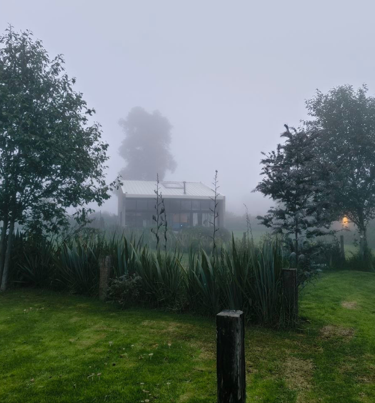 Fog surrounding a house in the mountains in Valle de Bravo